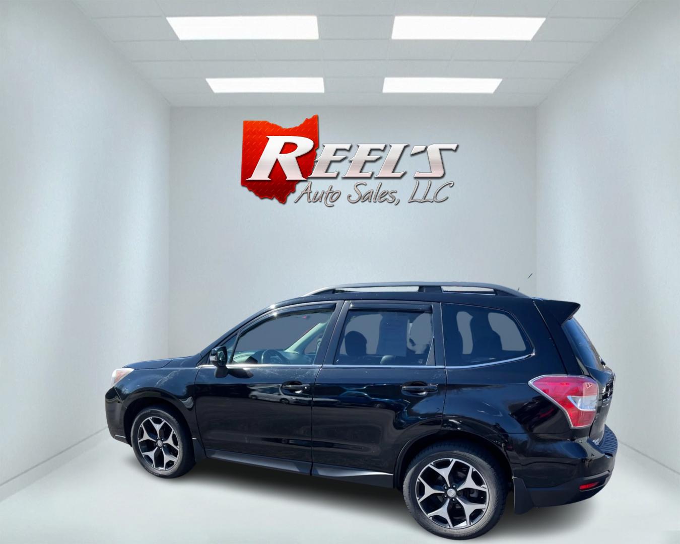 2014 Black /Black Subaru Forester 2.0XT Touring (JF2SJGMC4EH) with an 2.0L H4 SOHC 16V TURBO engine, Automatic transmission, located at 547 E. Main St., Orwell, OH, 44076, (440) 437-5893, 41.535435, -80.847855 - This 2014 Subaru Forester 2.0XT Touring is a well-equipped compact SUV featuring a powerful 2.0L turbocharged engine matched with a continuously variable transmission (CVT) for a blend of performance and efficiency. It boasts a range of high-end amenities, including heated seats, X-Mode for enhanced - Photo#8